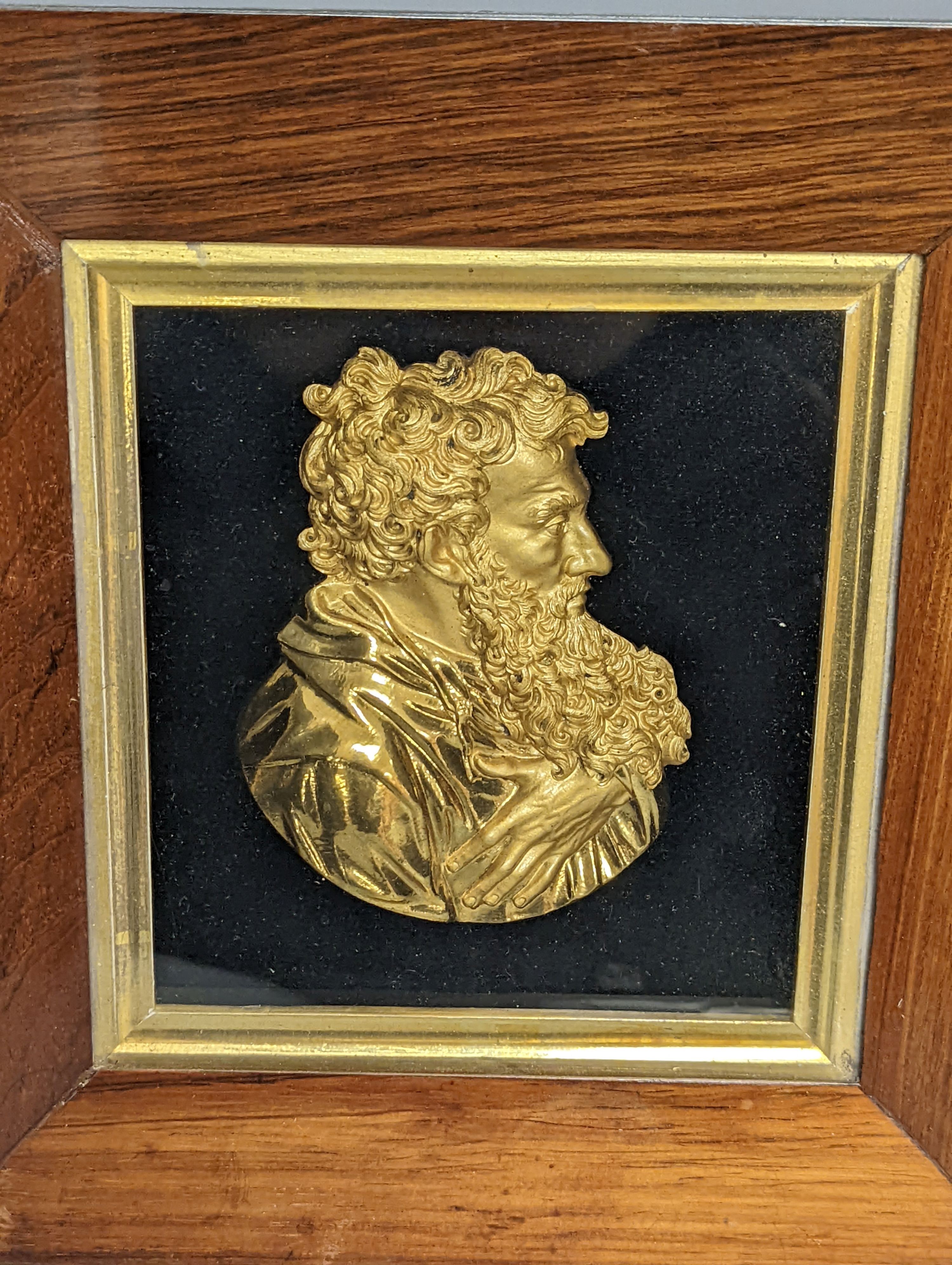 A pair of mid 19th century gilt-bronze portrait reliefs of Greek philosophers?, each in rosewood frames, width 23cm overall